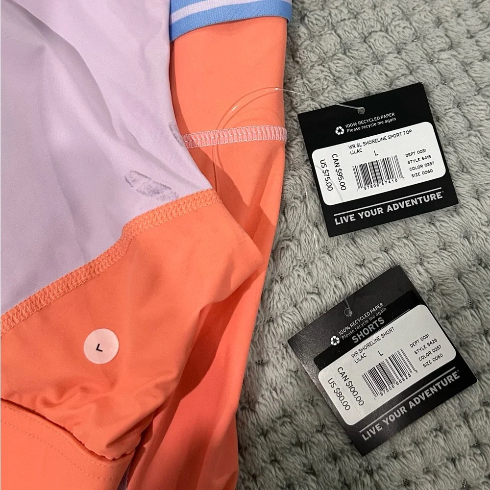 Two Pieces Of Eddie Bauer Lilac and Peach Sports Bra and shorts